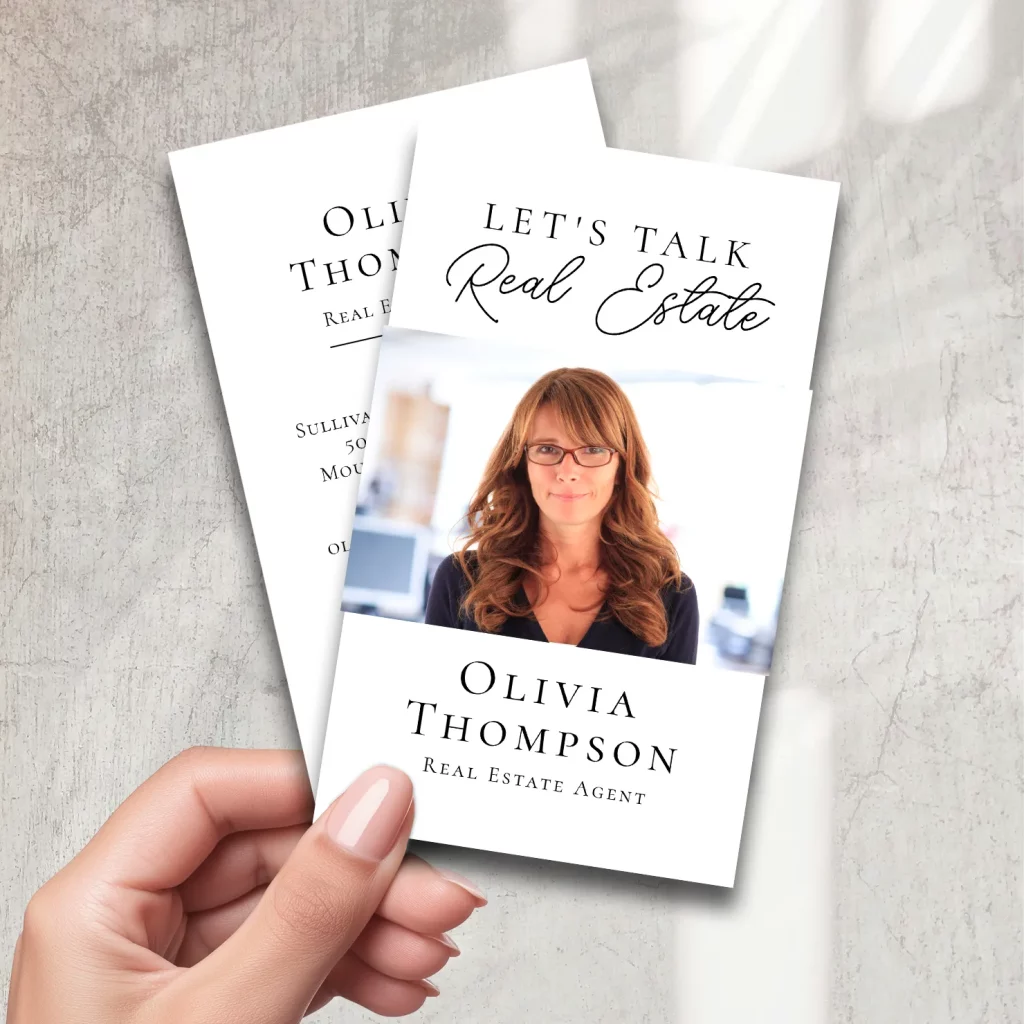 White real estate agent business card with portrait and elegant script