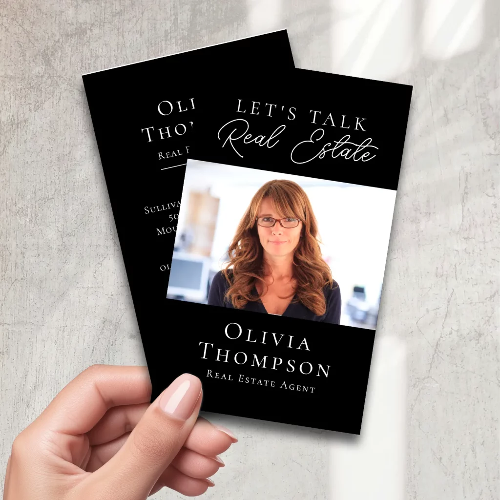 Elegant black real estate business card with photo and script font